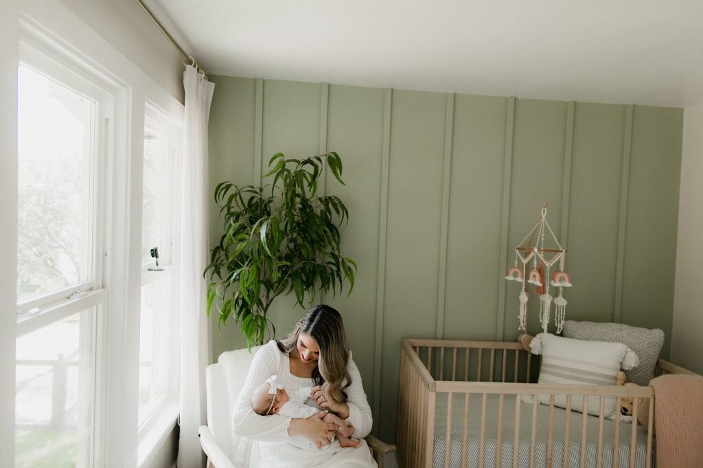 lifestyle family newborn session in beautiful baby nursery in seattle