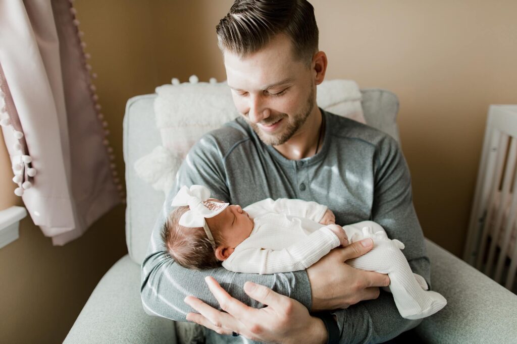 auburn family newborn in home lifestyle session with baby girl and dog