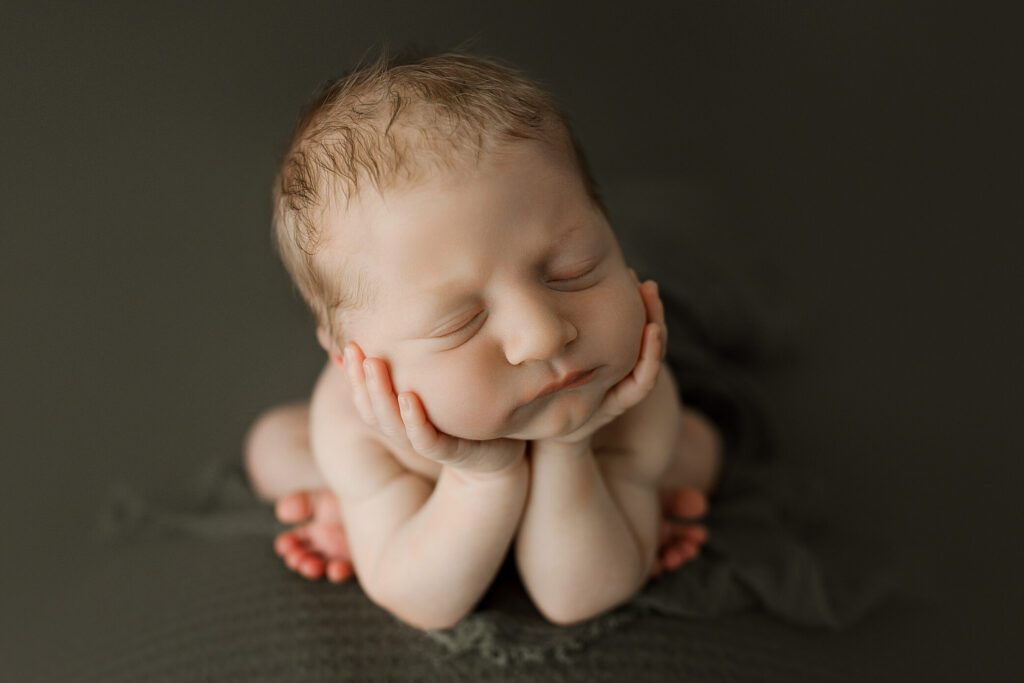 Sleeping newborn posed in studio Tacoma WA