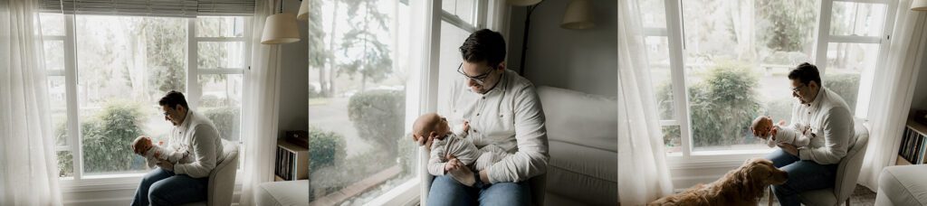 father holding newborn baby during Seattle lifestyle newborn photography session at home