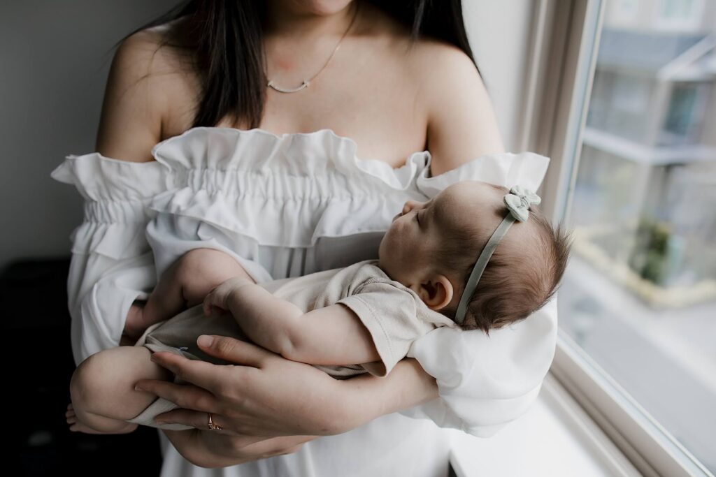 seattle newborn session with mom holding baby girl