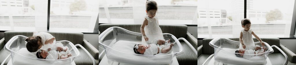 Sibling meeting newborn baby for the first time during a Tacoma Fresh 48 session